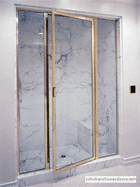 brass-framed shower door