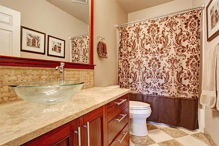 luxury bathroom with brown paisley pattern shower curtain