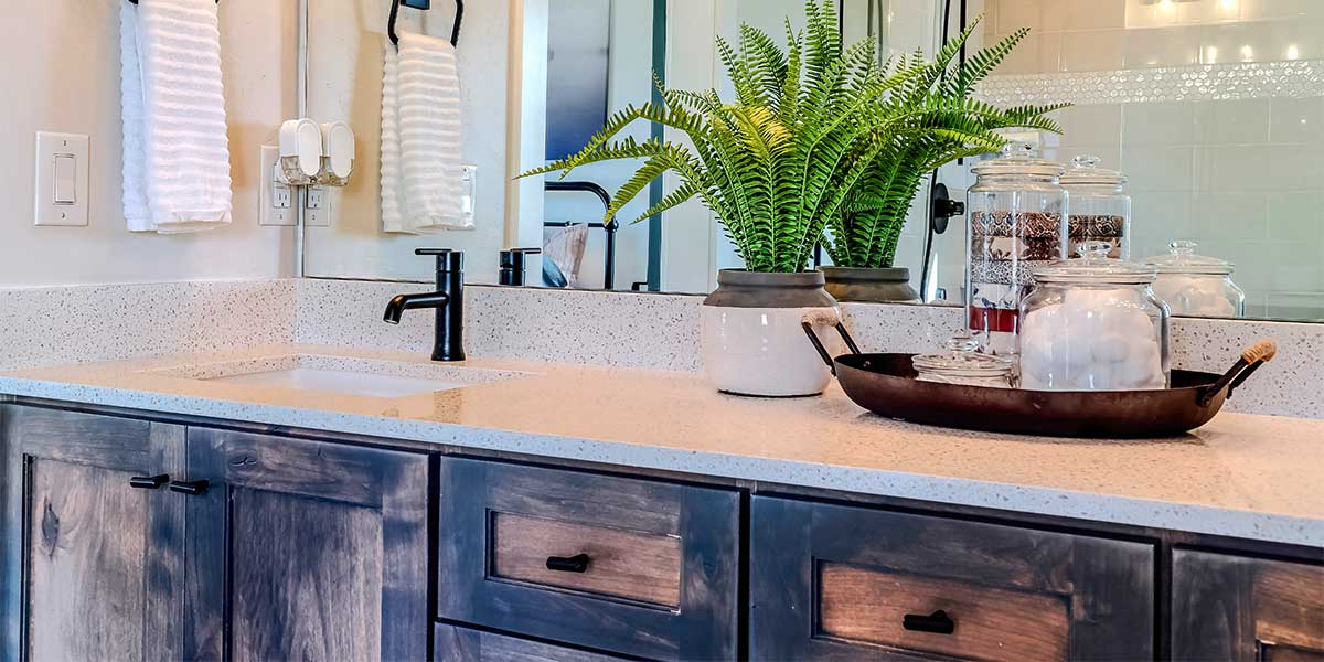 bathroom vanity with distressed rustic wood cabinets and drawers