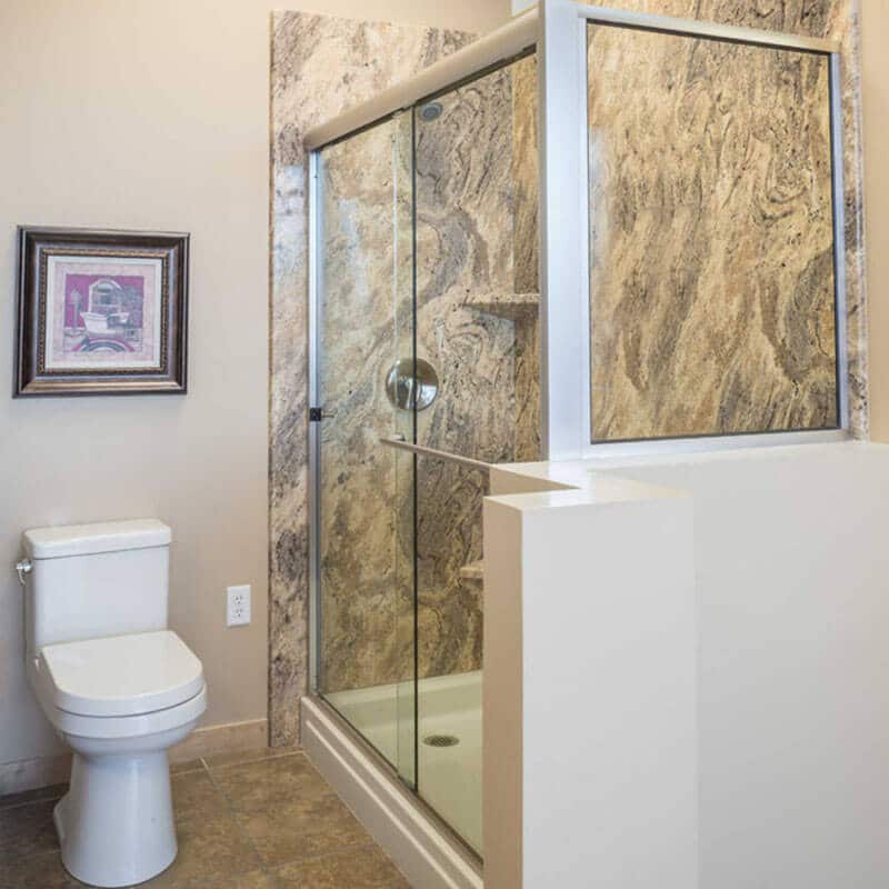 brass framed shower door with matte finish