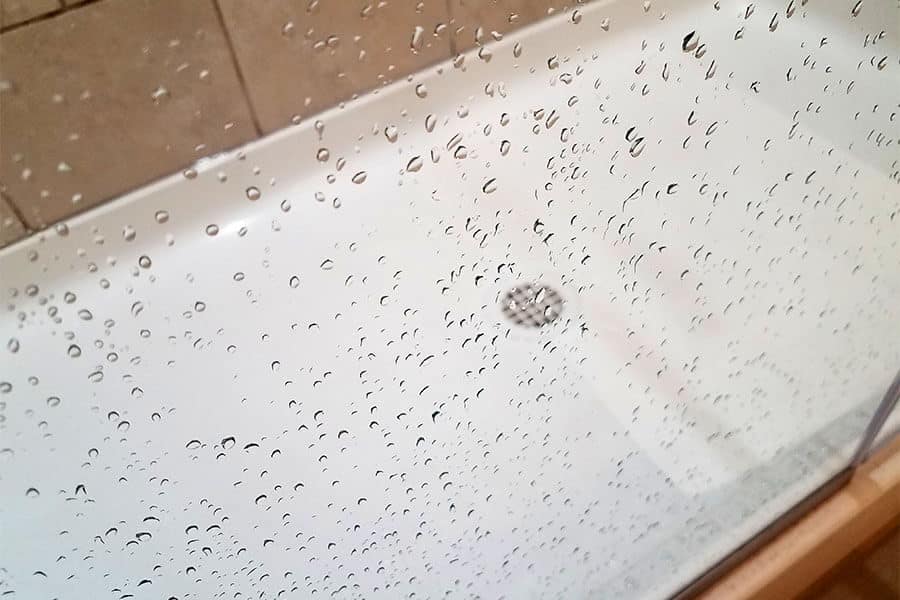shower glass door with water droplets