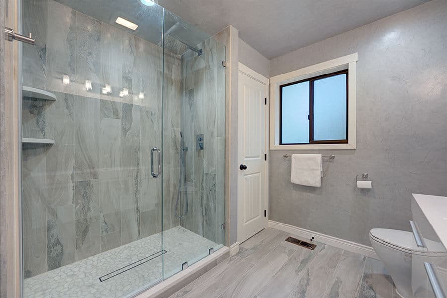 7 Hot Shower Door Trends for 2024 2 frameless shower door modern white bathroom