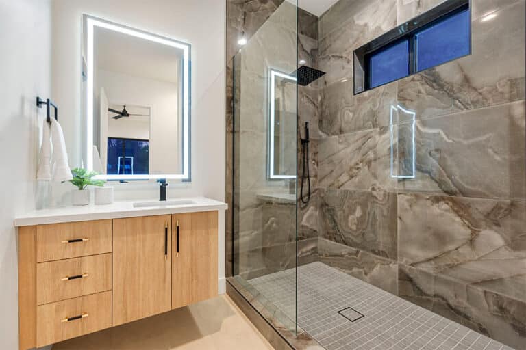 custom fit frameless shower door in small bathroom